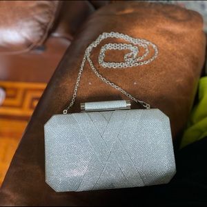Silver clutch, new.